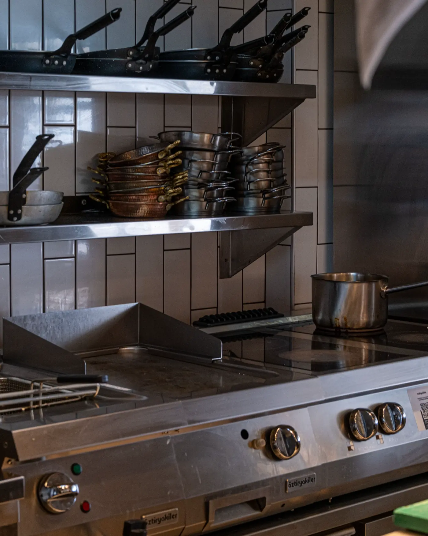 Commercial kitchen equipment on stainless steel shelving